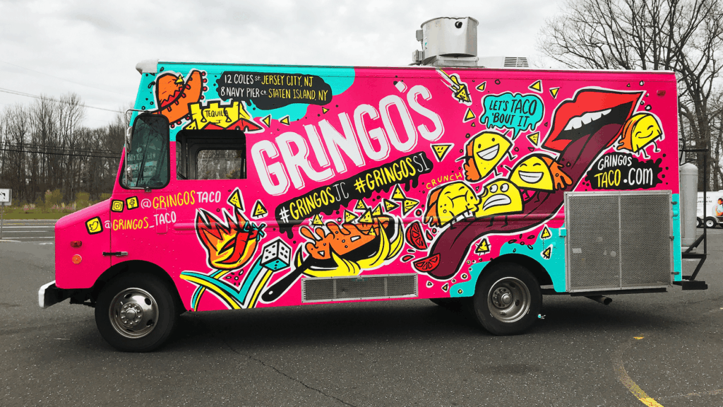 Food truck wrapped by Prime Graphics Lab featuring a vibrant, custom vinyl design that highlights the brand’s logo and colors.