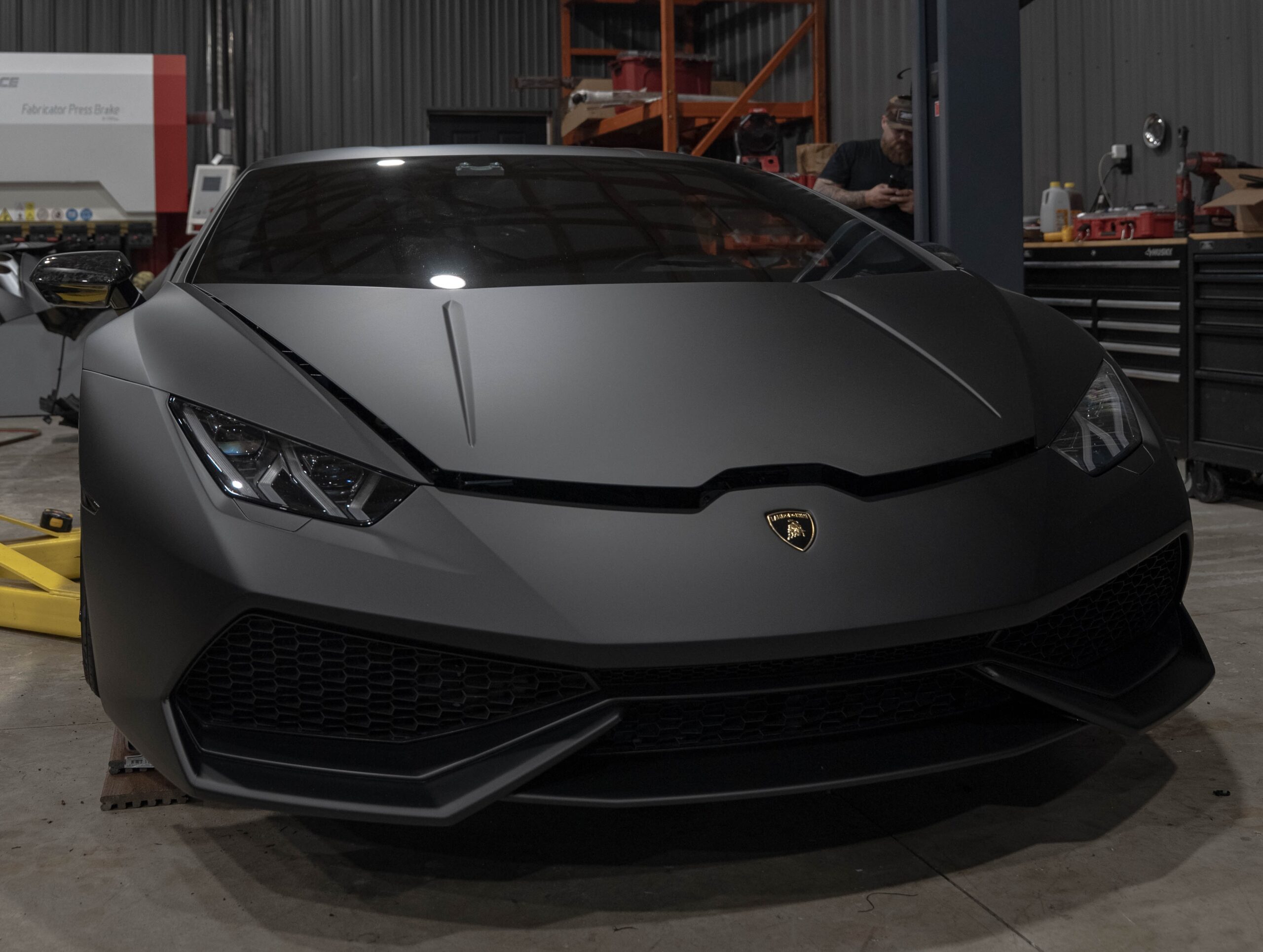 Black Lamborghini wrapped in INOZETEK Dynamic Paint Protection Film by Prime Graphics Lab, showcasing a sleek satin finish and glossy, protected exterior.